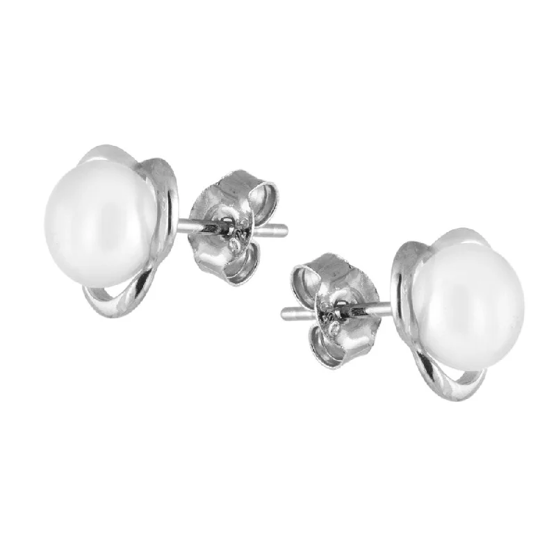 Sterling silver flower shaped earrings with button shaped pearls in the center - White